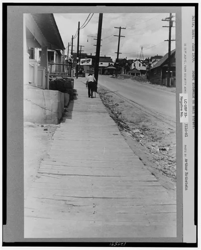 Board sidewalk on main street. Butte, Montana, 1939