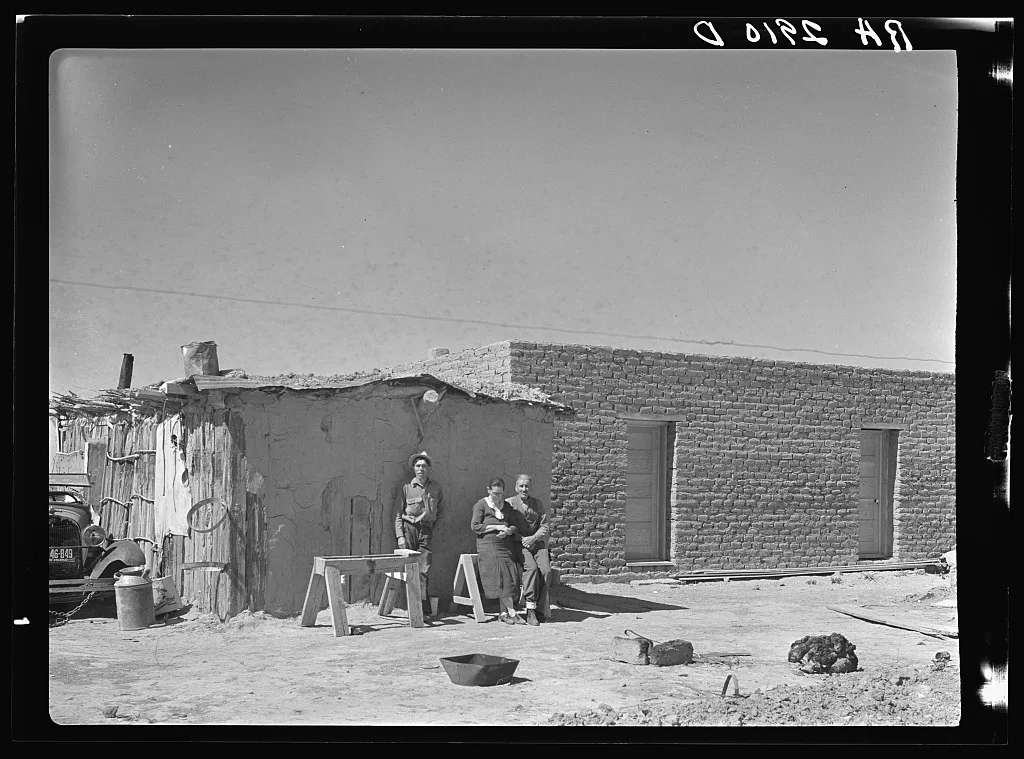 Rehabilitation clients. Mexican jacal on left in which they formerly…, New Mexico, 1936