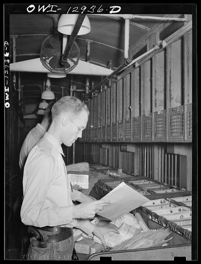 Handling mail on board a mail car, 1938