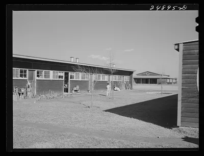 Row shelter with community building in background. Robstown FSA (Farm…, Texas, 1942