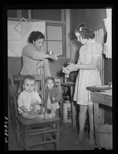 [Untitled photo, possibly related to: Family preparing tortillas for…, Texas, 1942