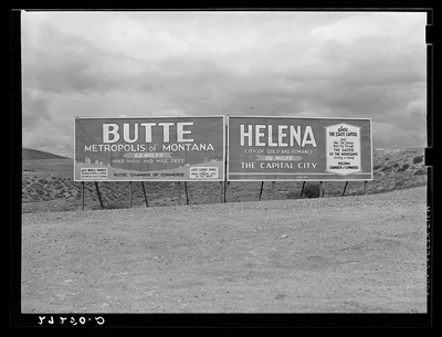 Signs at highway intersection. Three Forks, Montana, 1939