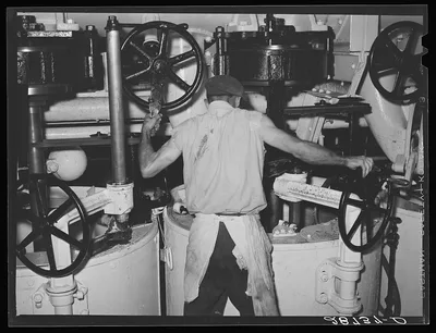 [Untitled photo, possibly related to: Operating a centrifugal…, Colorado, 1939