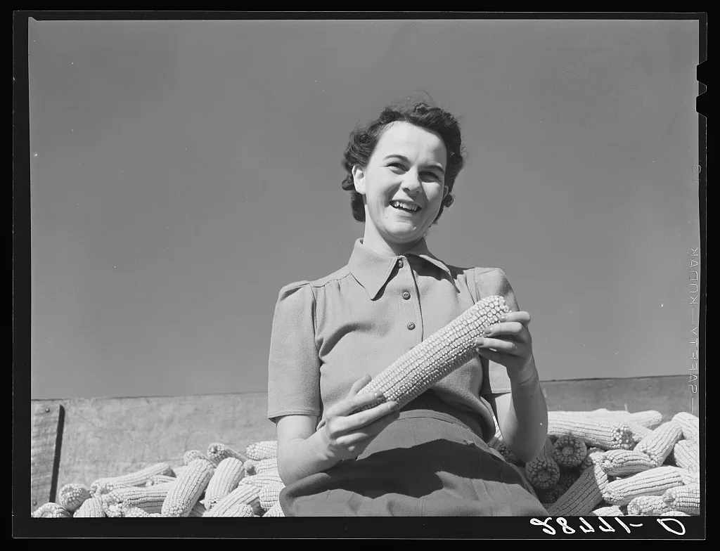 Mary Ellen Clarke with hybrid seed corn. Grundy County, Iowa, 1939