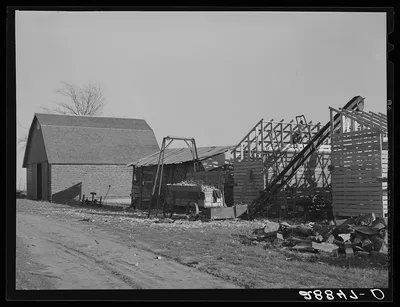 Farmer erects a new corn crib during harvest. Grundy Center, Iowa, 1939