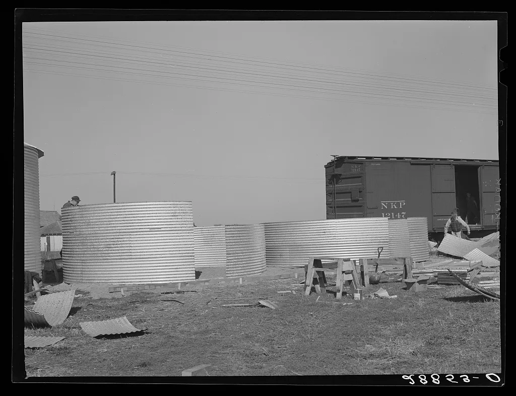 Erecting bins for corn storage under ever-normal granary plan.…, Iowa, 1939