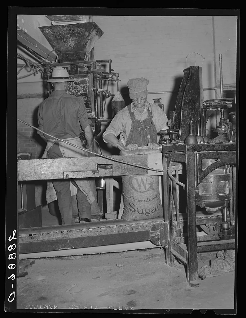 Filling bags with sugar. Brighton, Colorado, 1939