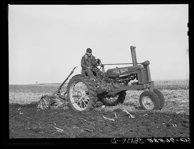 Fred Wilfang, rehabilitation client, uses modern tractor bought with…, Iowa, 1939