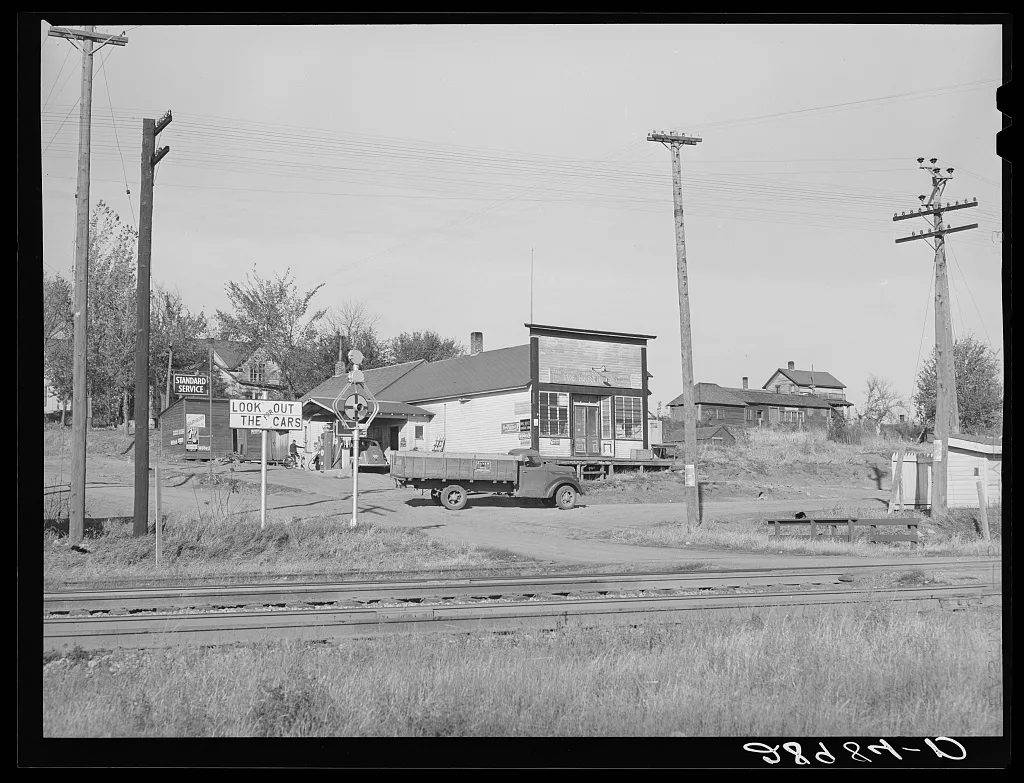 A village consisting of a few houses, general store, and railroad…, Iowa, 1939