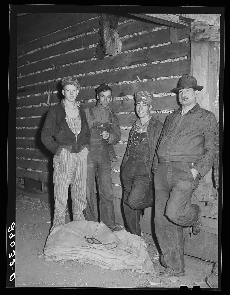 The gleaners, men who gather the ears left by the picker. Cornhusking…, Iowa, 1939