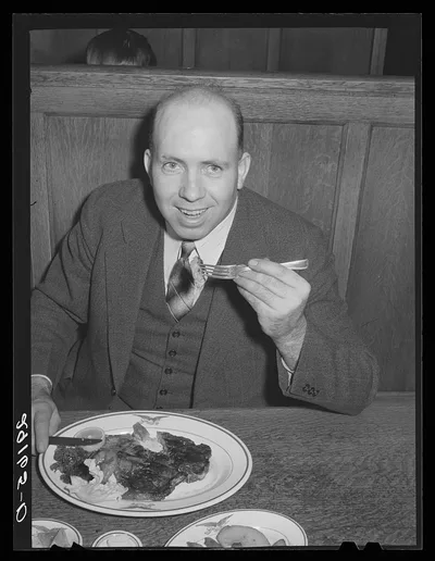 Photograph from Nebraska: Diner with steak. Scotts Bluff, Nebraska