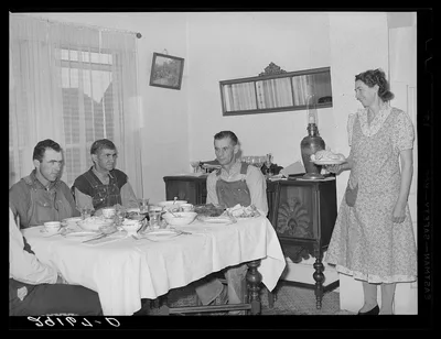 Farmers at dinner. Greene County, Missouri, 1939