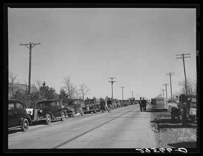 Farmer's cars line the highway near Zimmerman farm auction. Hastings,…, Nebraska, 1940