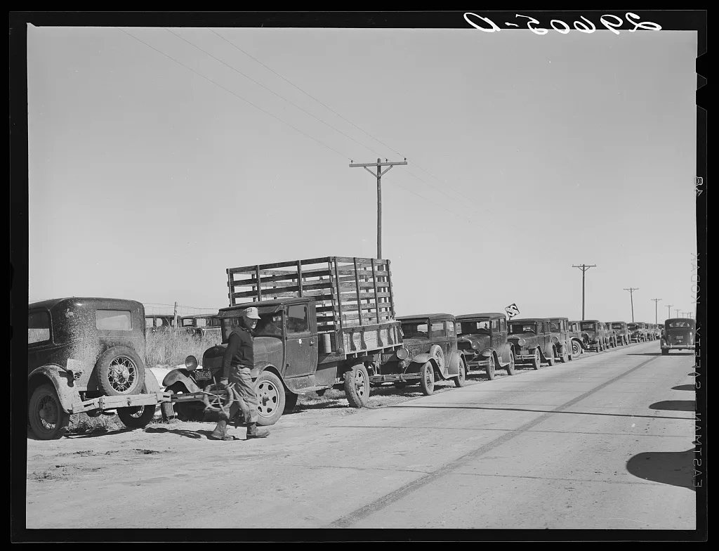[Untitled photo, possibly related to: Farmer's cars line the highway…, Nebraska, 1940