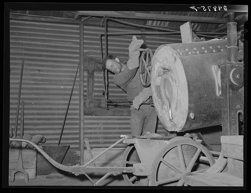 Pouring a gold brick. El Dorado Canyon, Clark County, Nevada, 1940