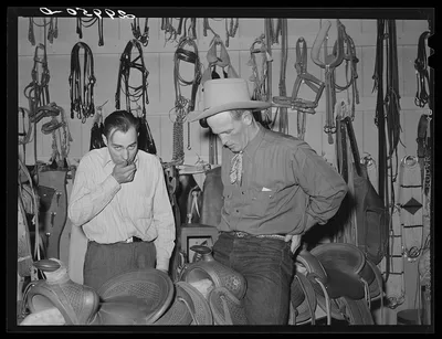 [Untitled photo, possibly related to: Cowhand tries on chaps.…, Nevada, 1940